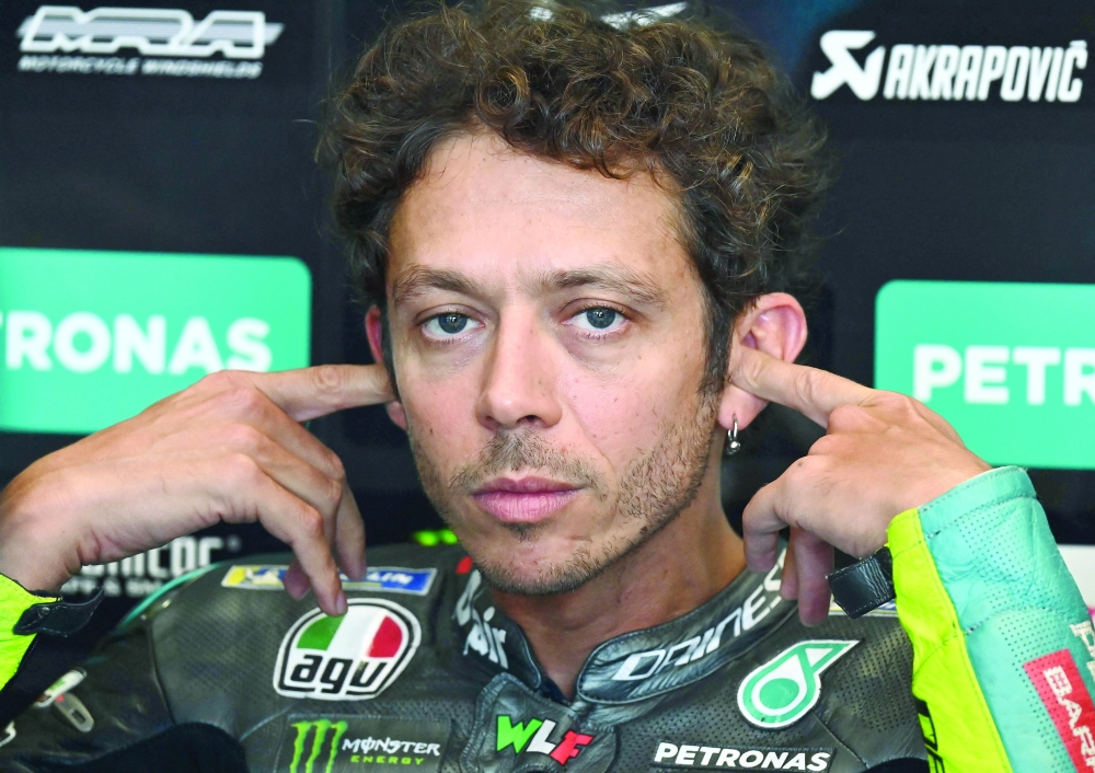 Valentino Rossi puts in his ear-plugs during the third free practice session ahead of the Styrian MotoGP in Spielberg, Austria. -- AFP 