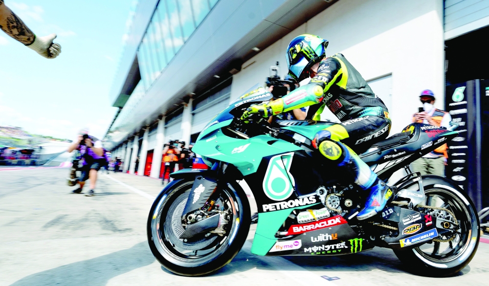 Yamaha-SRT Italian rider Valentino Rossi leaves the garage on his motorbike for the third free practice session ahead of the Styrian MotoGP in Spielberg, Austria. -- AFP 