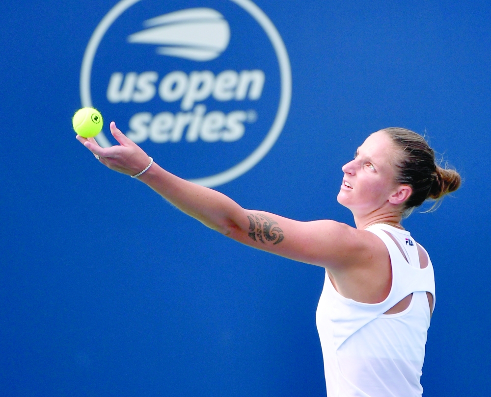 Karolina Pliskova of the Czech Republic serves against Amanda Anisimova of the United States (not pictured) during third round play at Stade IGA. -- USA Today Sports
