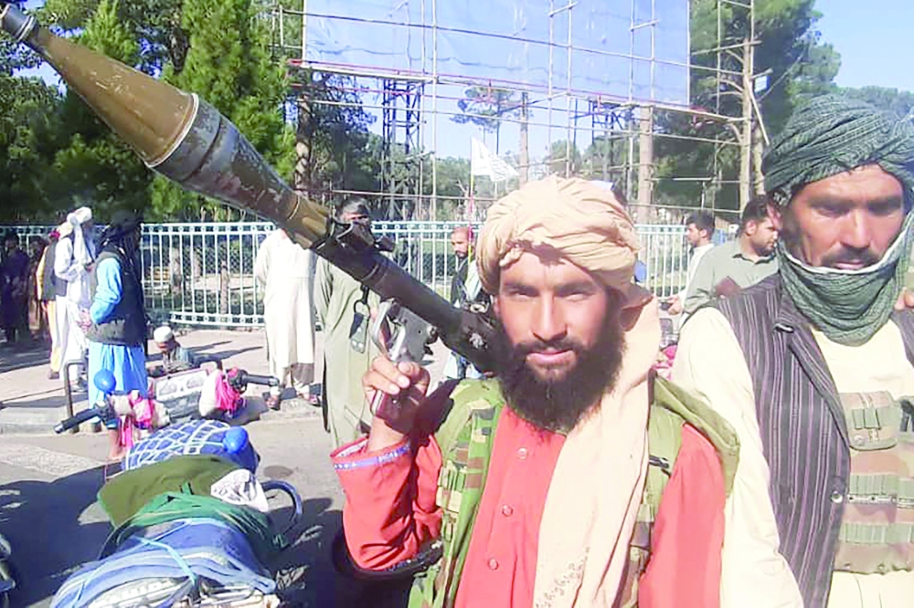 A Taliban fighter is seen with a rocket-propelled grenade in Herat after they took control of city.  -- AFP