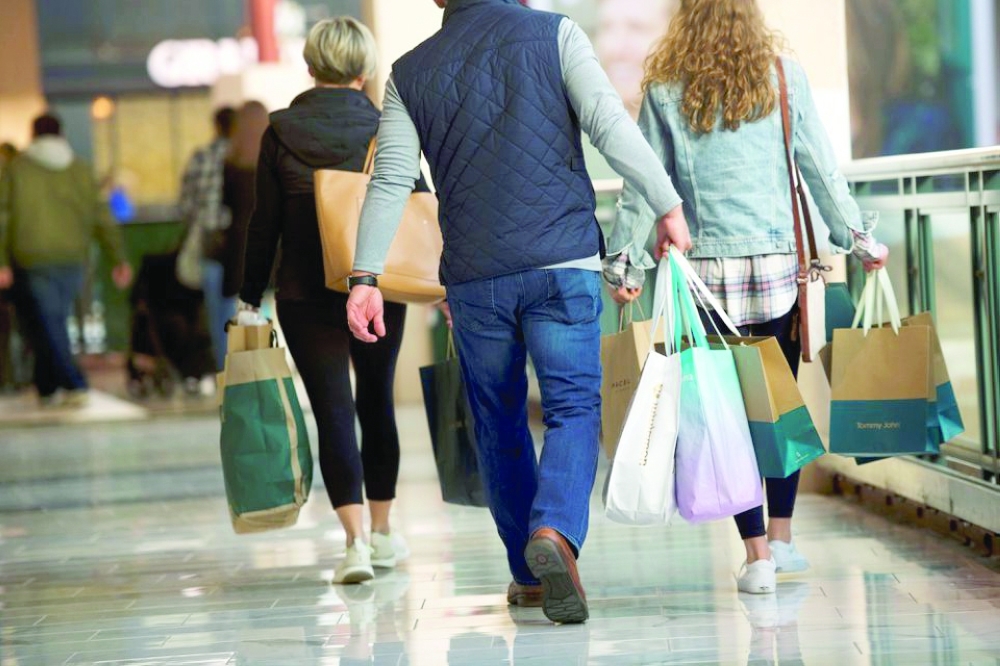 Shoppers carry bags of purchased merchandise in Pennsylvania. — Reuters