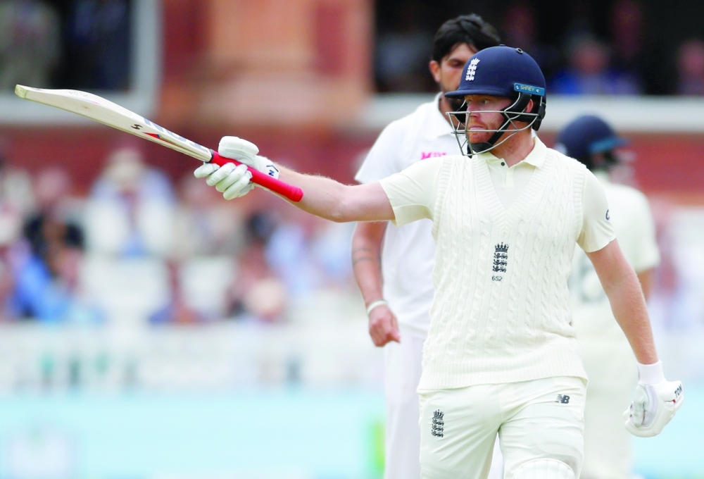 England's Jonny Bairstow celebrates reaching his half century. -- Reuters