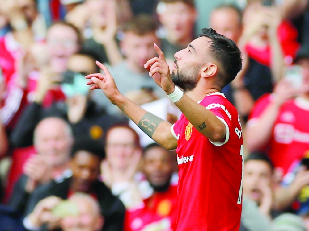 Manchester United's Bruno Fernandes celebrates scoring their first goal. -- Reuters