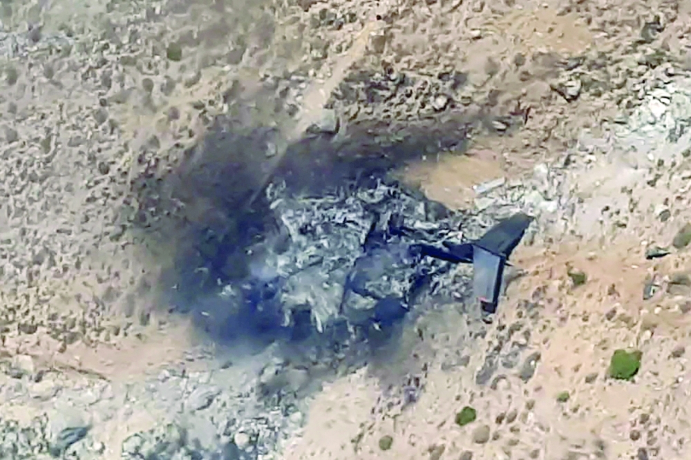 This videograb image shows a general view of the wreckage of a Russias Bombadier Be-200 aircraft at Kahramanmaras, southern Turkey.  -- AFP