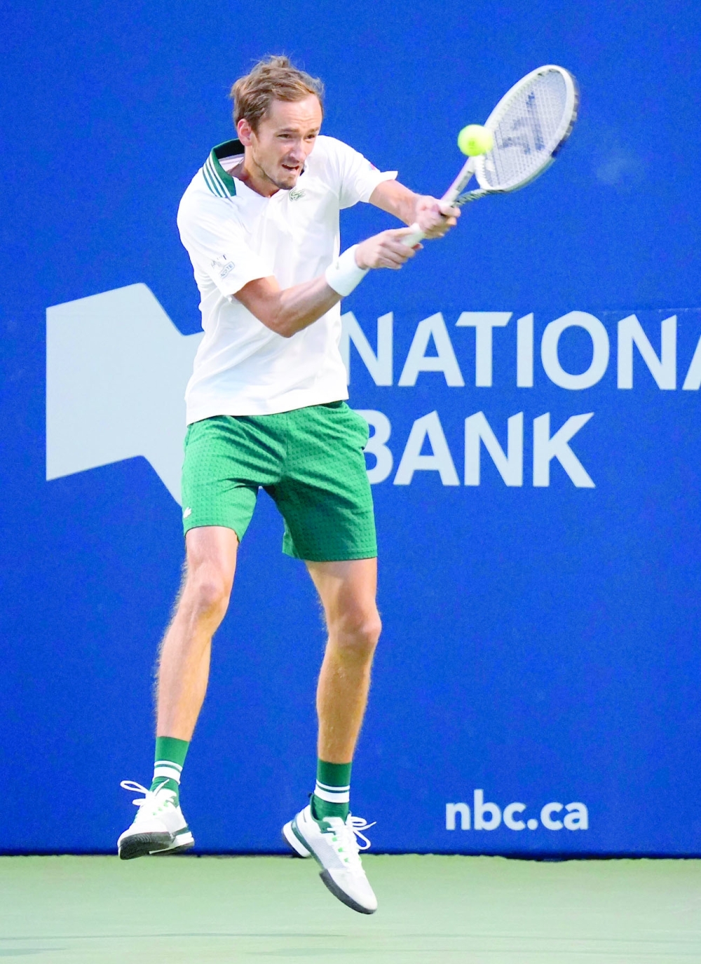 Daniil Medvedev of Russia returns a ball to John Isner of the United States at Aviva Centre. -- USA Today Sports