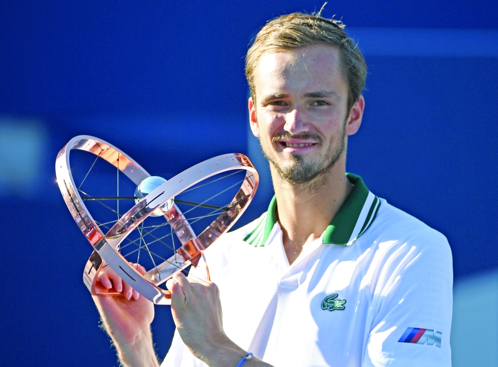 Daniil Medvedev of Russia poses with the trophy in Toronto. -- USA Today Sports