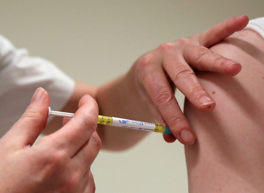 A volunteer receives a dose of CureVac vaccine or a placebo during a study by the German biotech firm CureVac as part of a testing for a new vaccine against the coronavirus disease (COVID-19), in Brussels. -- Reuters