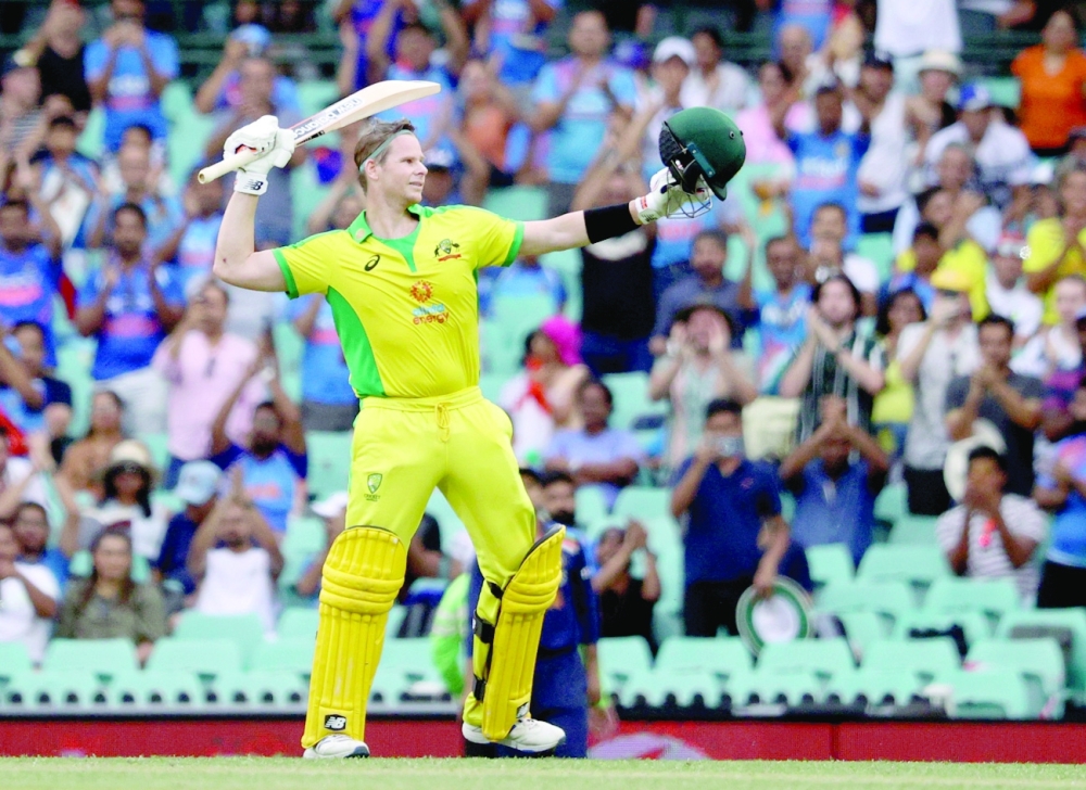 Australia's Steven Smith celebrates his century against India in Sydney. -- Reuters