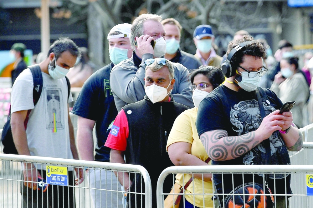 People wait in a queue for their Covid-19 coronavirus vaccination in Sydney. - AFP