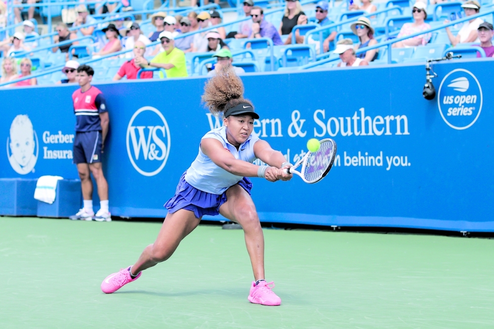 Naomi Osaka (JPN) returns a shot against Coco Gauff (USA). -- USA Today Sports 