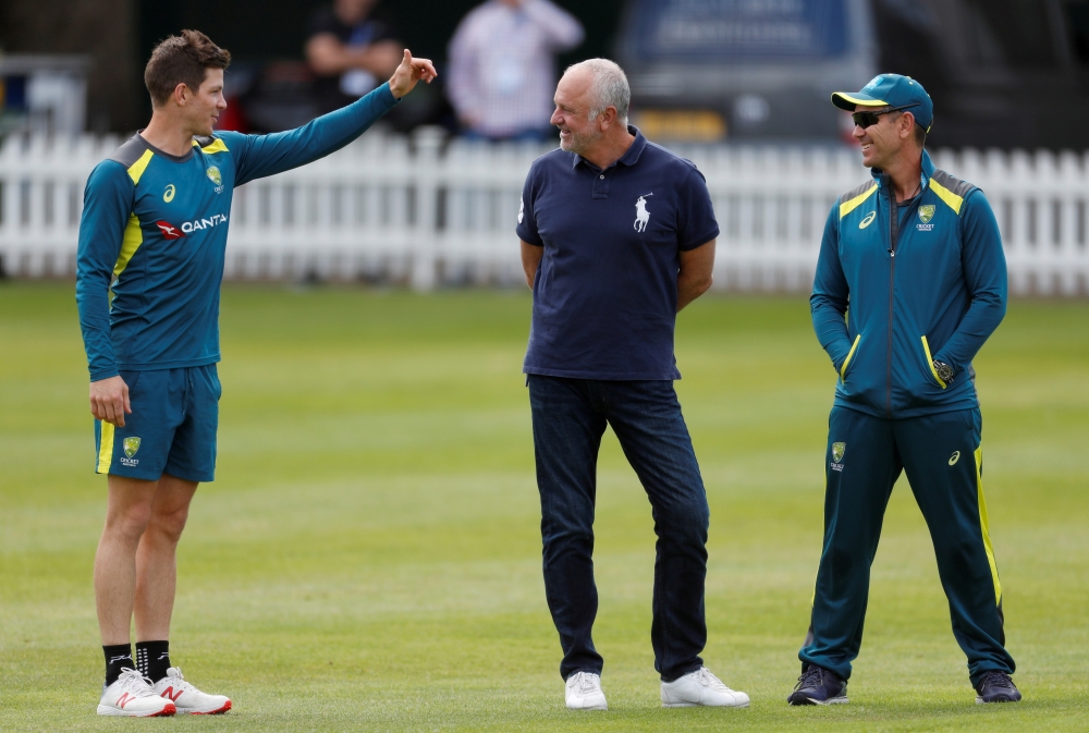 Australia's Tim Paine speaks to head coach Justin Langer. -- Reuters