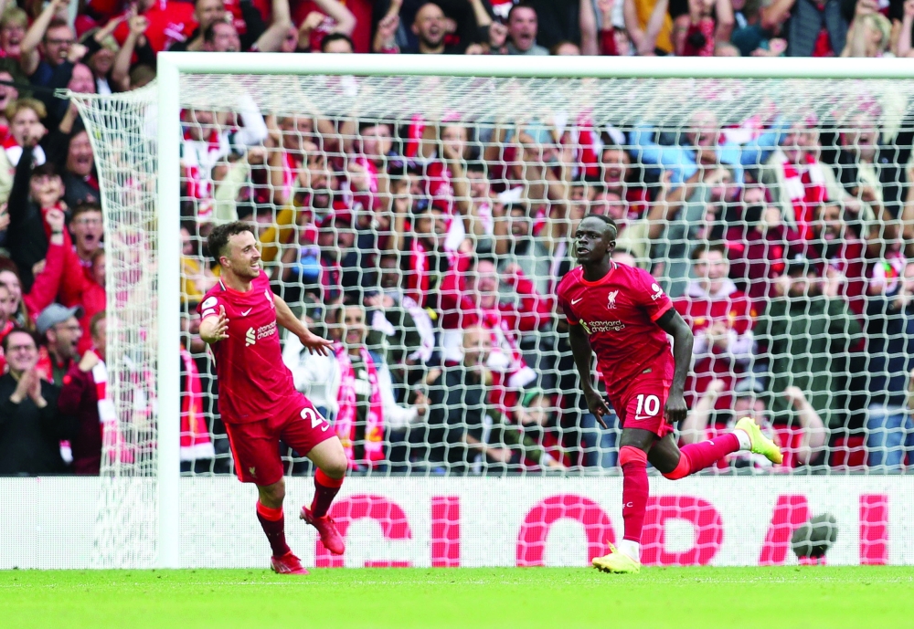 Liverpool's Sadio Mane celebrates scoring their second goal with Diogo Jota. -- Reuters 