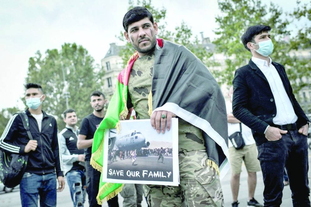 A protester during a rally in support for Afghanistan at Place de la Republique in Paris, France, on Sunday. - AFP
