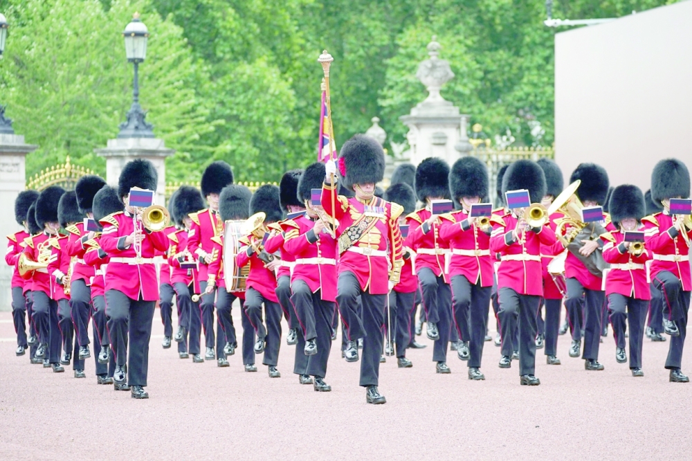 Members of the Nijmegen Company Grenadier Guards take part in the Changing of the Guard at Buckingham Palace on Monday. -- AFP
