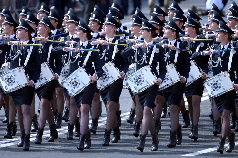 Ukrainian military band members march during the Independence Day military parade in Kiev on Tuesday. -- AFP