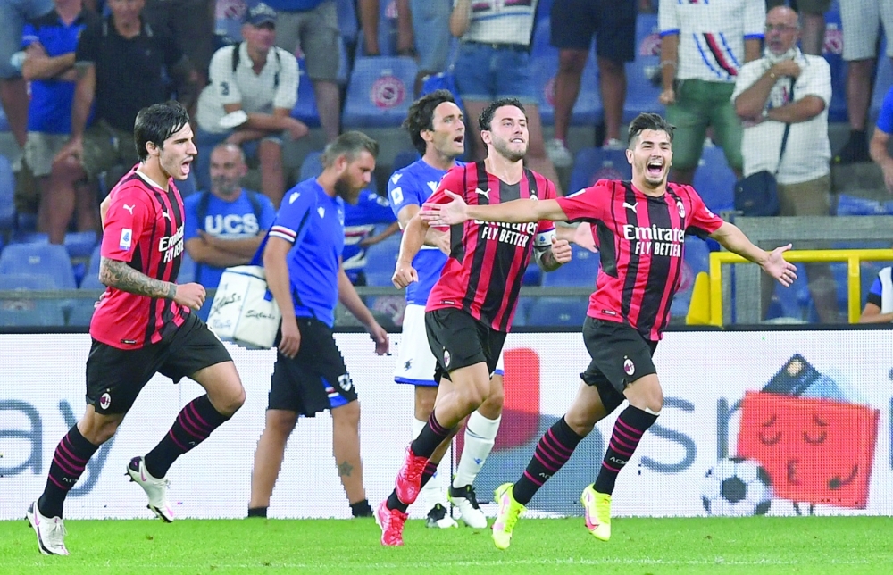 AC Milan's Spanish midfielder Brahim Diaz (R) celebrates after scoring against Sampdoria in Genova. -- Reuters