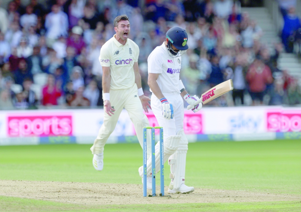 England's James Anderson celebrates taking the wicket of India's Virat Kohli. -- Reuters