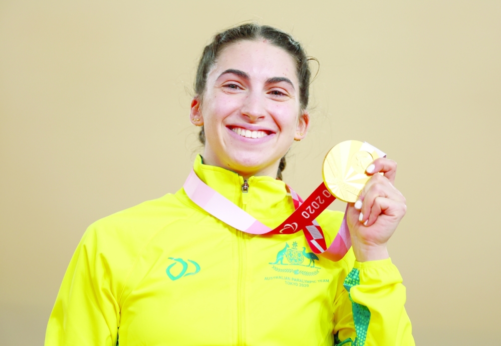 Gold medallist Paige Greco of Australia celebrates after winning women's C1-3 3000m Individual Pursuit cycling. -- Reuters 