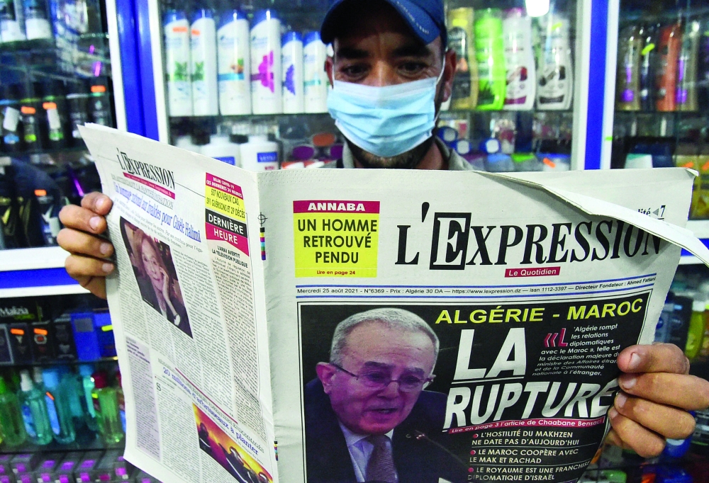 An Algeria man holds today's newspaper in the capital Algiers. Algeria's Foreign Minister Ramtane Lamamra said the previous day that his country has severed diplomatic relations with Morocco due to "hostile actions", following months of resurgent tensions between the North African rivals. -- AFP 