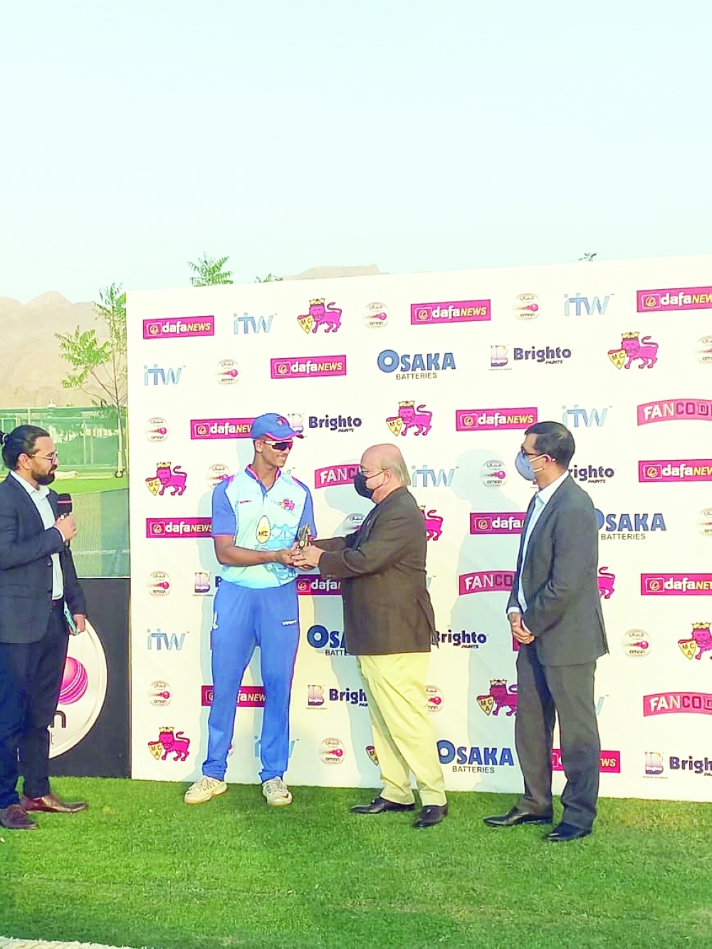 Mumbai's Yashasvi Jaiswal receiving man of the match prize from Kiran Asher, Director, Oman Cricket Board.