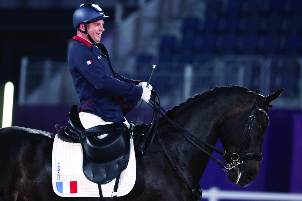 France's Vladimir Vinchon riding Fidertanz For Rosi competes in the equestrian dressage individual test grade IV event. -- AFP