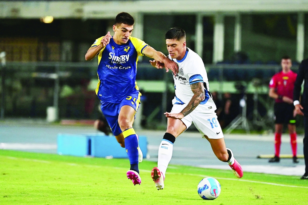 Inter Milan's Joaquin Correa vies with Hellas Verona's Bosko Sutalo during the Serie A match. -- AFP