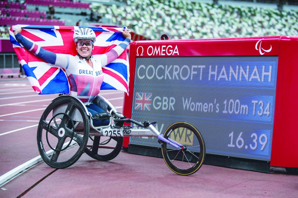 Britain's Hannah Cockroft reacts after competing in the women's 100m - T34 final of the Tokyo 2020 Paralympic Games at the Olympic Stadium in Tokyo on August 29, 2021. (Photo by Philip FONG / AFP)


