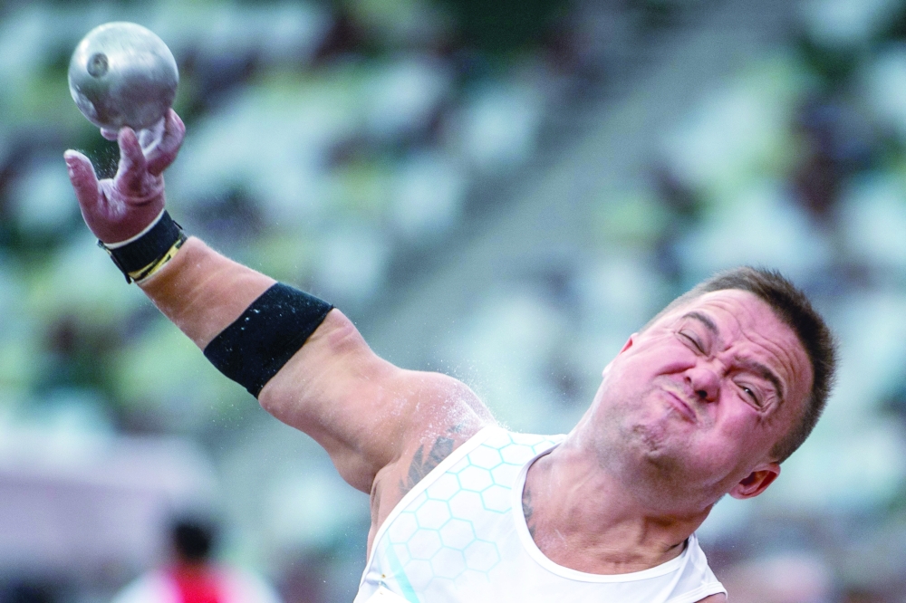Russian Paralympic Committee's Denis Gnezdilov competes in the men's shot put - F40 final of the Tokyo 2020 Paralympic Games at the Olympic Stadium in Tokyo on August 29, 2021. (Photo by Philip FONG / AFP)

