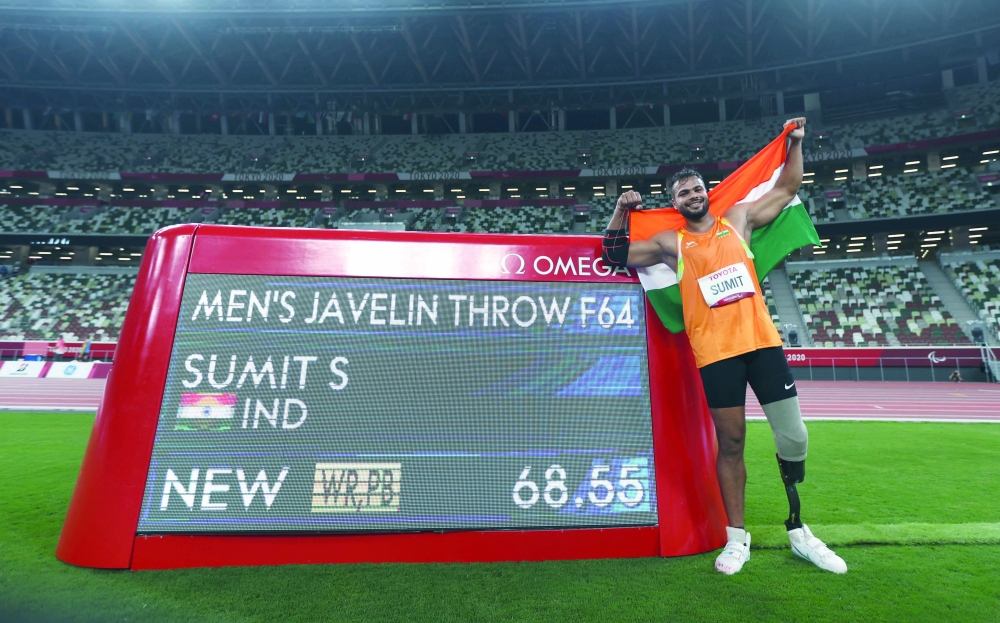 Gold Medallist Sumit Sumit of India celebrates after setting a new world record. -- Reuters in men's javelin - F64 final. -- Reuters 