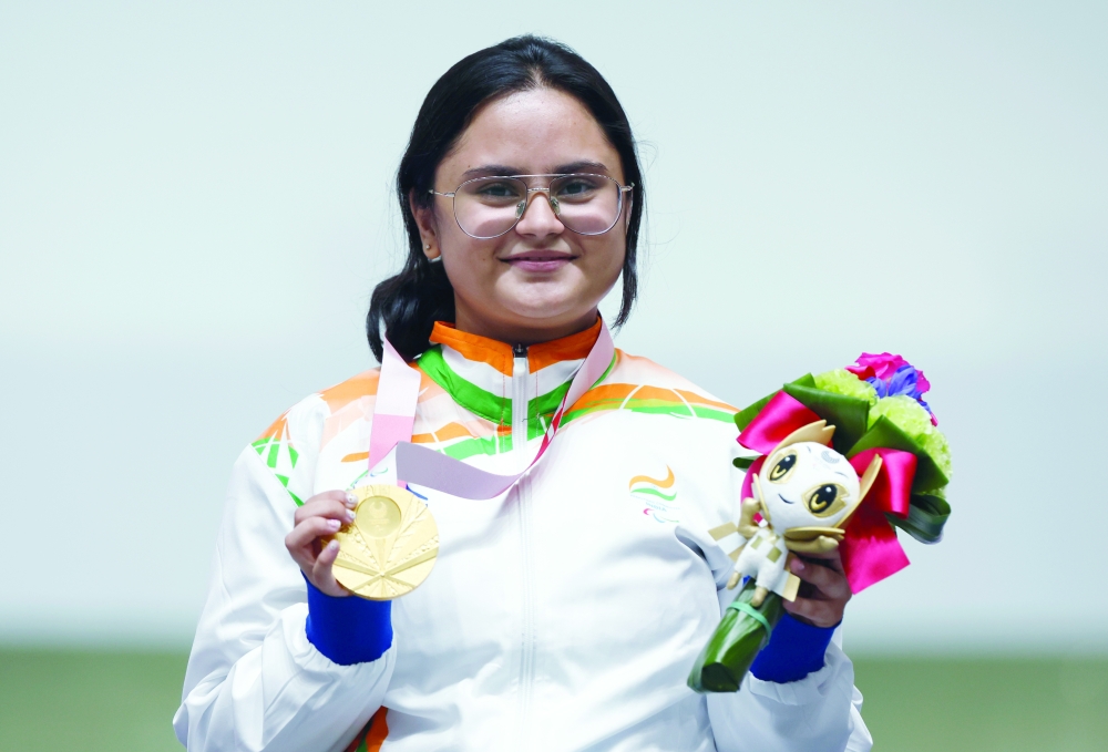 Gold medallist Avani Lekhara of India celebrates after winning the women's 10m Air Rifle shooting. -- Reuters