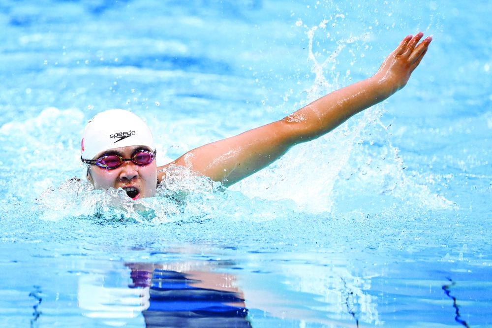 China's Jiang Yuyan competes in the women's 50m butterfly S6 swimming final. -- AFP 