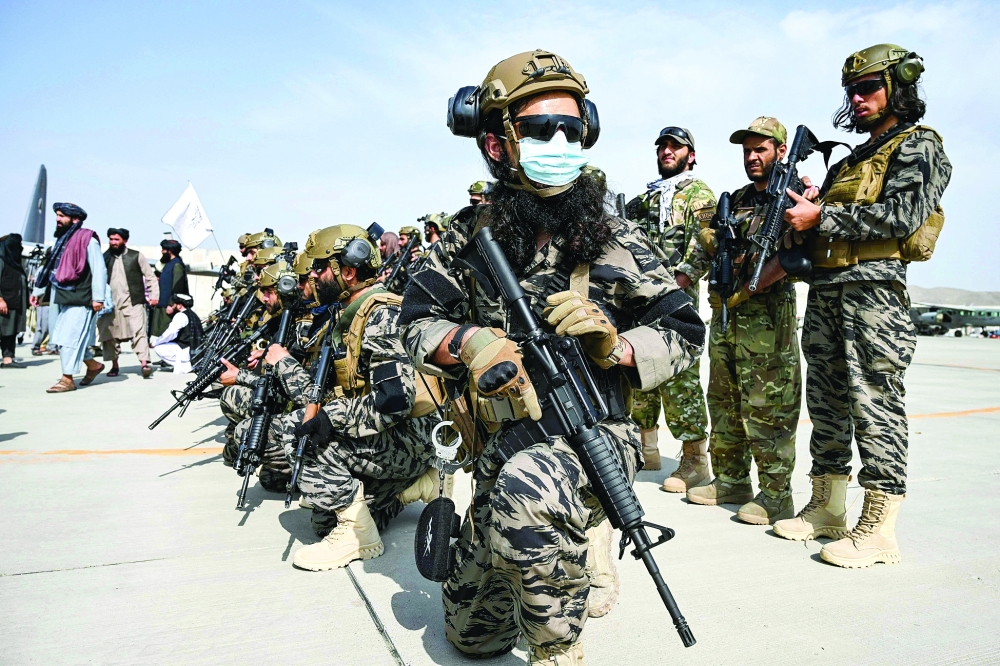 Members of the Taliban Badri 313 military unit take a position at the airport in Kabul. -- AFP

