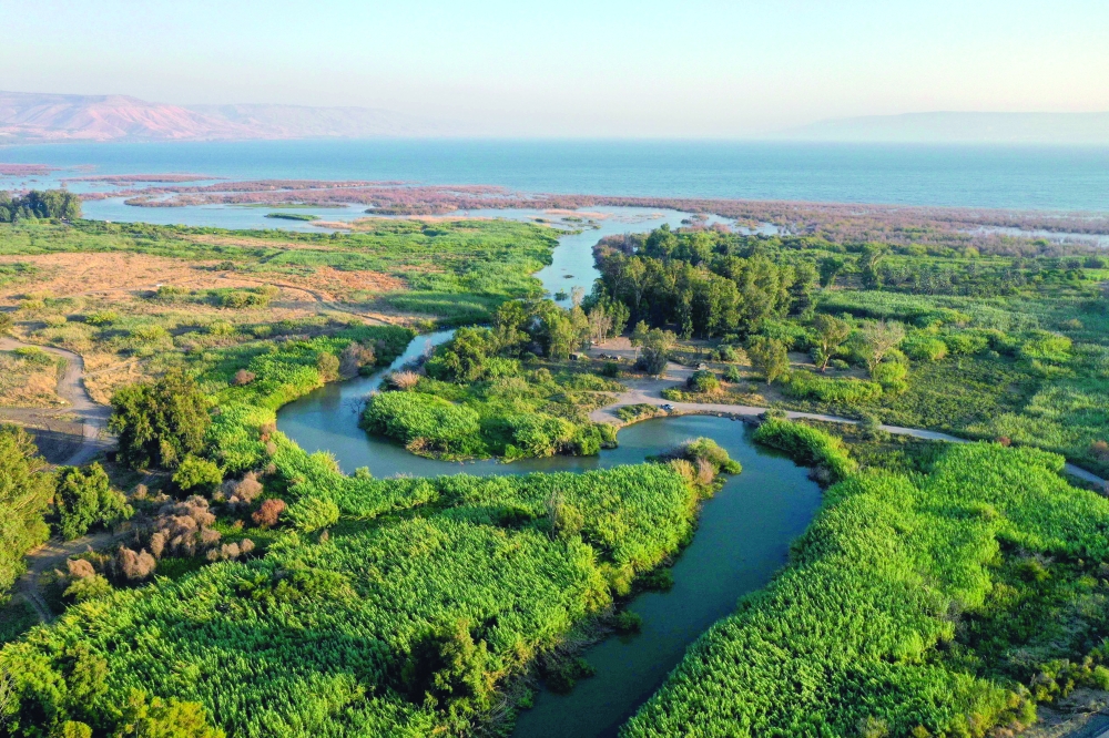 An aerial picture shows a section of the Jordan river flowing through the Beteha (Bethsaida Valley) into the northern part of the Sea of Galilee, or Lake Tiberias, one of the main water sources in Israel. -- AFP