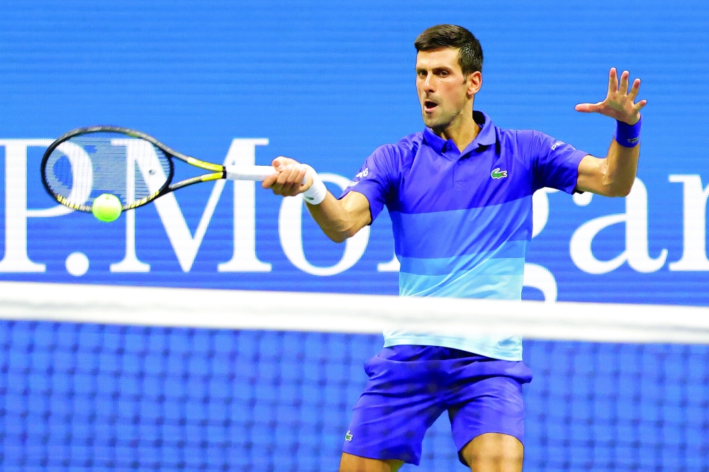 Novak Djokovic of Serbia hits a forehand against Holger Vitus Nodskov Rune of Denmark (not pictured). -- USA Today Sports