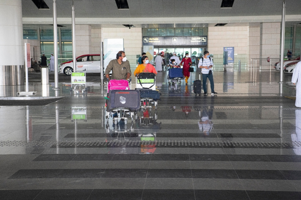 Stranded expatriates start arriving as Sultanate lifts travel