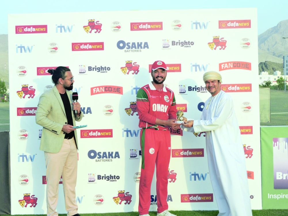 Ayaan receiving his man of the match prize from Pankaj Khimji, Chairman, Oman Cricket.
