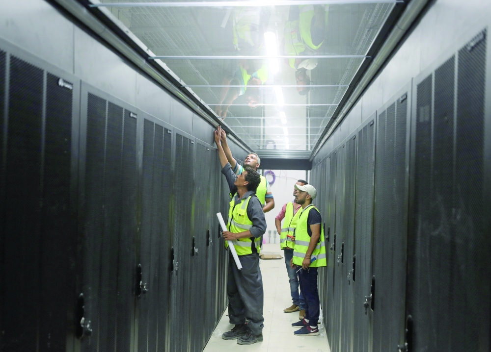 Engineers install server cabinets at an under construction data centre in the New Administrative Capital (NAC), east of Cairo. — Reuters
