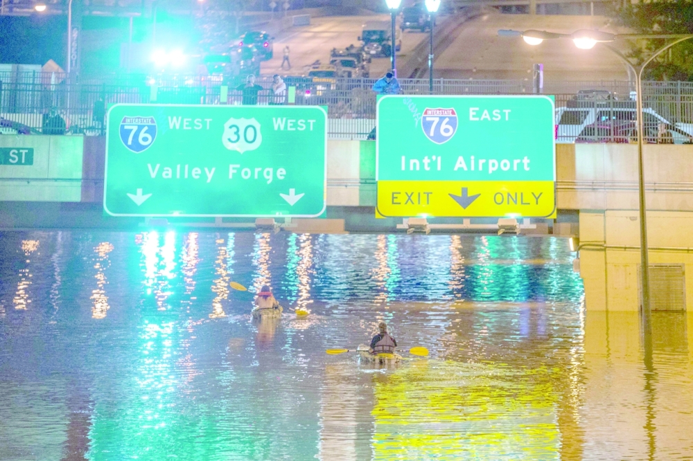 Roadways were transformed into river-like torrents in minutes as the downpours struck New York area, trapping drivers in quickly rising floodwaters. -- AFP