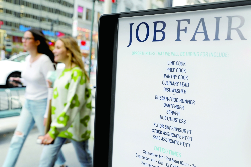 Signage for a job fair is seen on 5th Avenue after the release of the jobs report in Manhattan, New York City. - Reuters