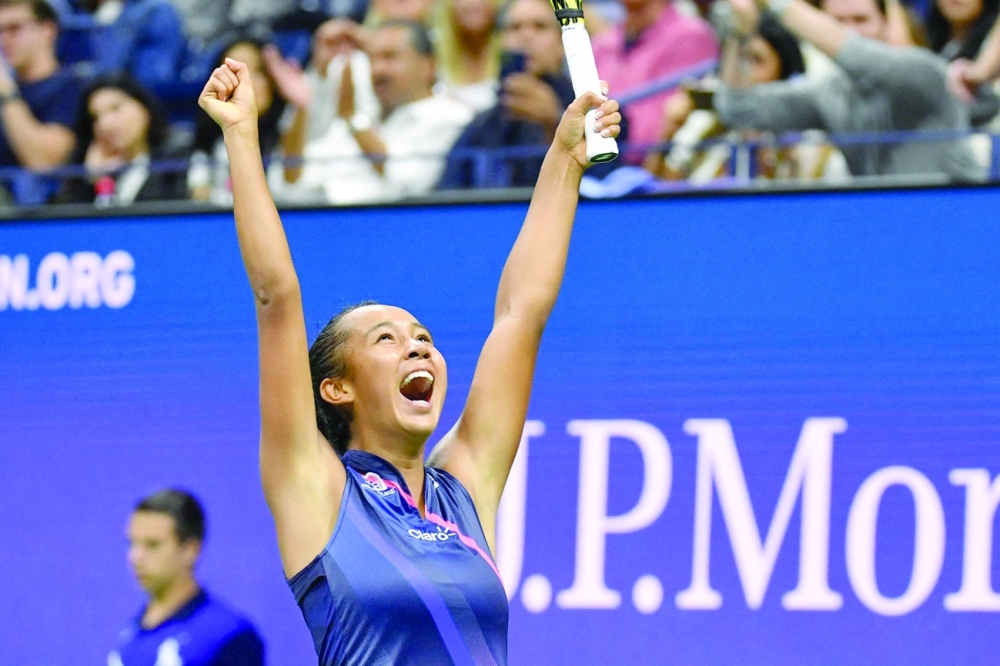 Canada's Leylah Fernandez celebrates after winning her women's singles third round match against Japan's Naomi Osaka. -- AFP