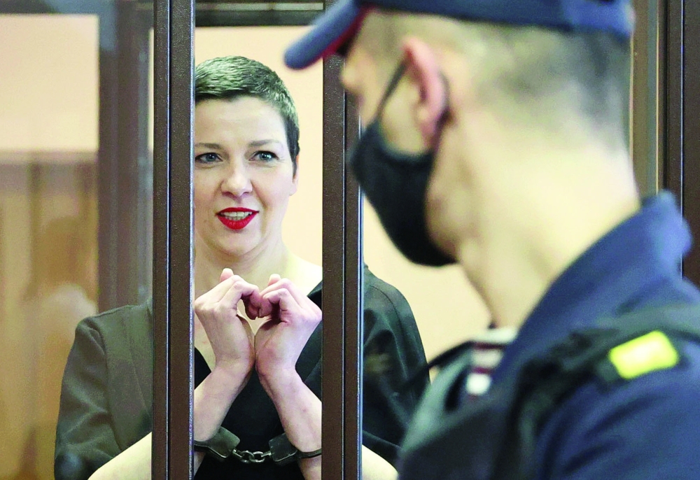 Belarusian opposition politician Maria Kolesnikova, charged with extremism and trying to seize power illegally, inside a defendants' cage as she attends a court hearing in Minsk. - AFP