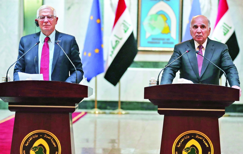 Iraqi Foreign Minister Fouad Hussein (R) and Josep Borrell, High Representative of the European Union for Foreign Affairs and Security Policy, at a joint press conference at Baghdad International Airport in Baghdad. - AFP