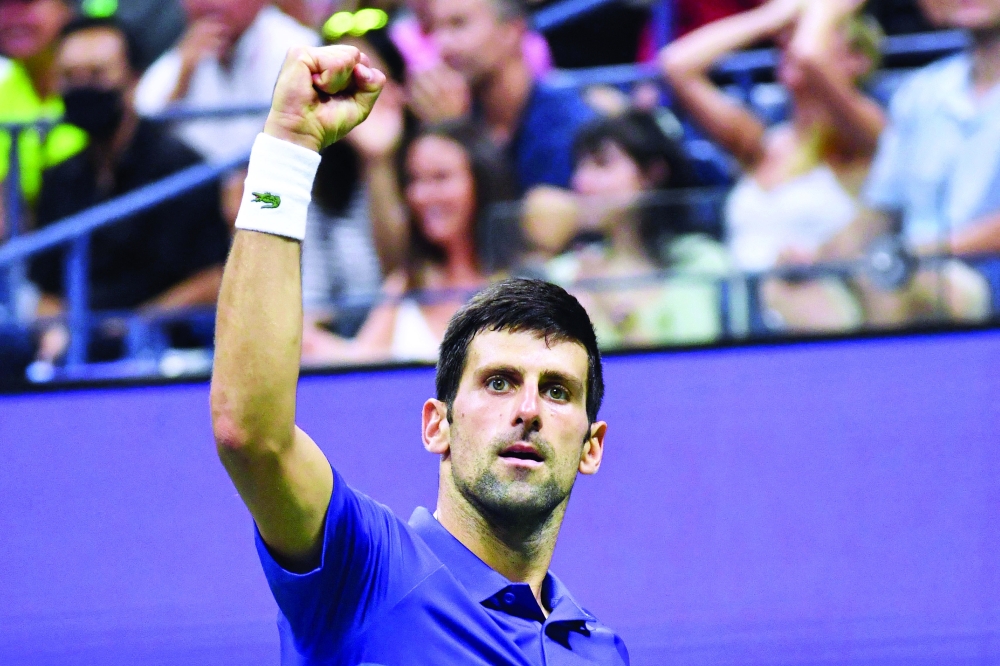 Serbia's Novak Djokovic celebrates after winning a point against USA's Jenson Brooksby. -- AFP

