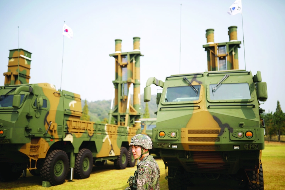 A South Korean soldier walks past Hyunmoo-2 (L) and Hyunmoo-3 ballistic missiles ahead of a celebration to mark the 69th anniversary of Korea Armed Forces Day, in Pyeongtaek. — Reuters file photo