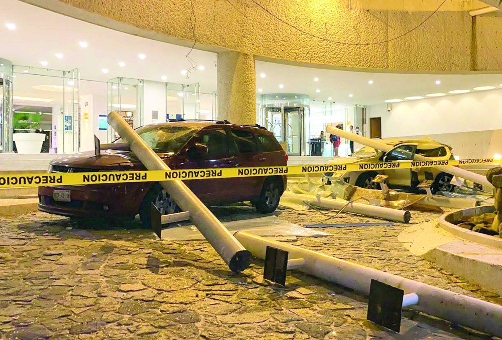 View of damaged cars outside a hotel after a quake in Acapulco, Guerrero state, Mexico. — AFP