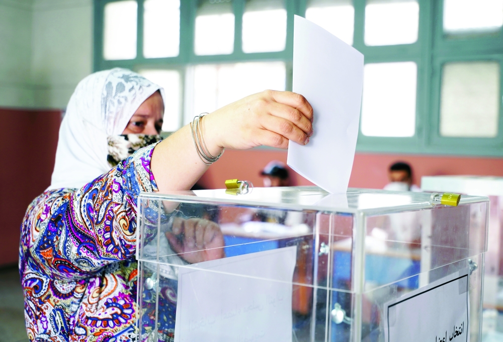 A woman casts her vote at a polling station during parliamentary and local elections in Casablanca, Morocco, on Wednesday. — Reuters
