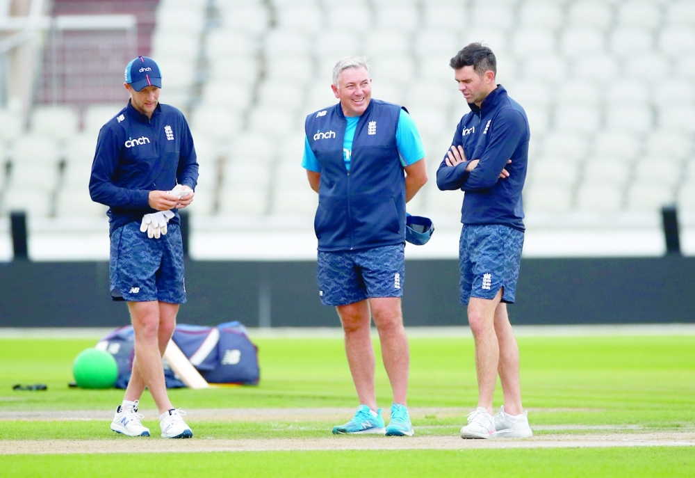 England's Joe Root and James Anderson with head coach Chris Silverwood during nets 