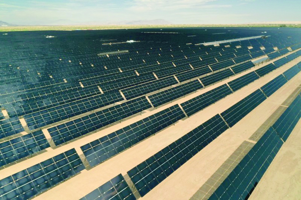 FILE PHOTO: Arrays of photovoltaic solar panels are seen at the Tenaska Imperial Solar Energy Center South as the spread of the coronavirus disease (COVID-19) continues in this aerial photo taken over El Centro, California