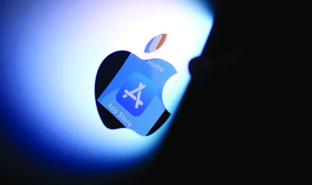Illustration photo shows the Apple app store logo reflected from an iPhone onto the back of an iMac in Los Angeles. - AFP File 