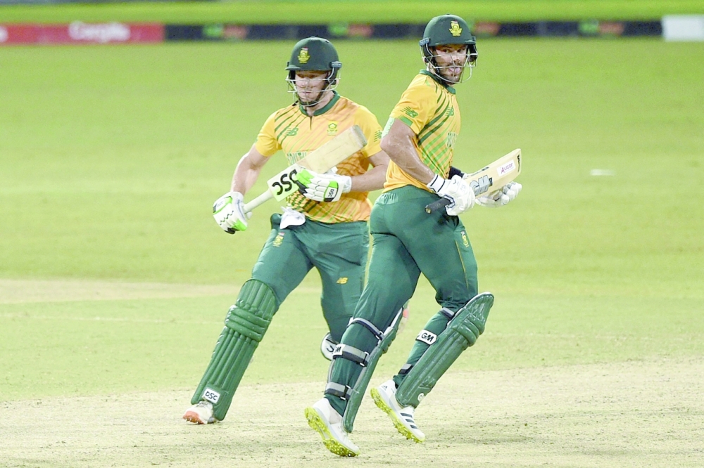 South Africa's Aiden Markram (R) and David Miller run between the wickets. -- AFP